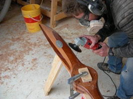 V-2-3 man grinding on wood 